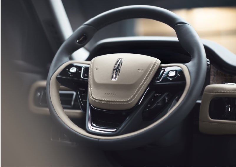 The intuitively placed controls of the steering wheel on a 2023 Lincoln Aviator® SUV | Dave Sinclair Lincoln St. Peters in Saint Peters MO