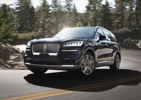 A Lincoln Aviator® SUV is being driven on a winding mountain road | Dave Sinclair Lincoln St. Peters in Saint Peters MO