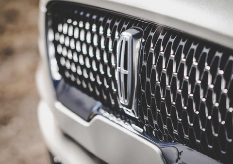 The grille of the 2024 Lincoln Aviator® Reserve model with an eye-catching repeated field of Lincoln Star logo shapes | Dave Sinclair Lincoln St. Peters in Saint Peters MO