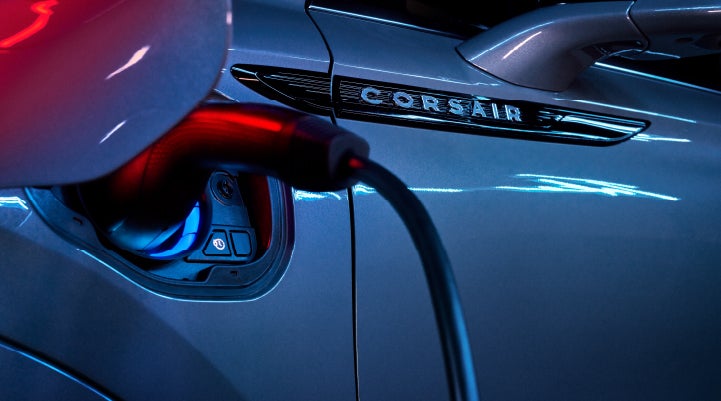 A charger plugged into the charging port of a 2024 Lincoln Corsair® Plug-in Hybrid model. | Dave Sinclair Lincoln St. Peters in Saint Peters MO